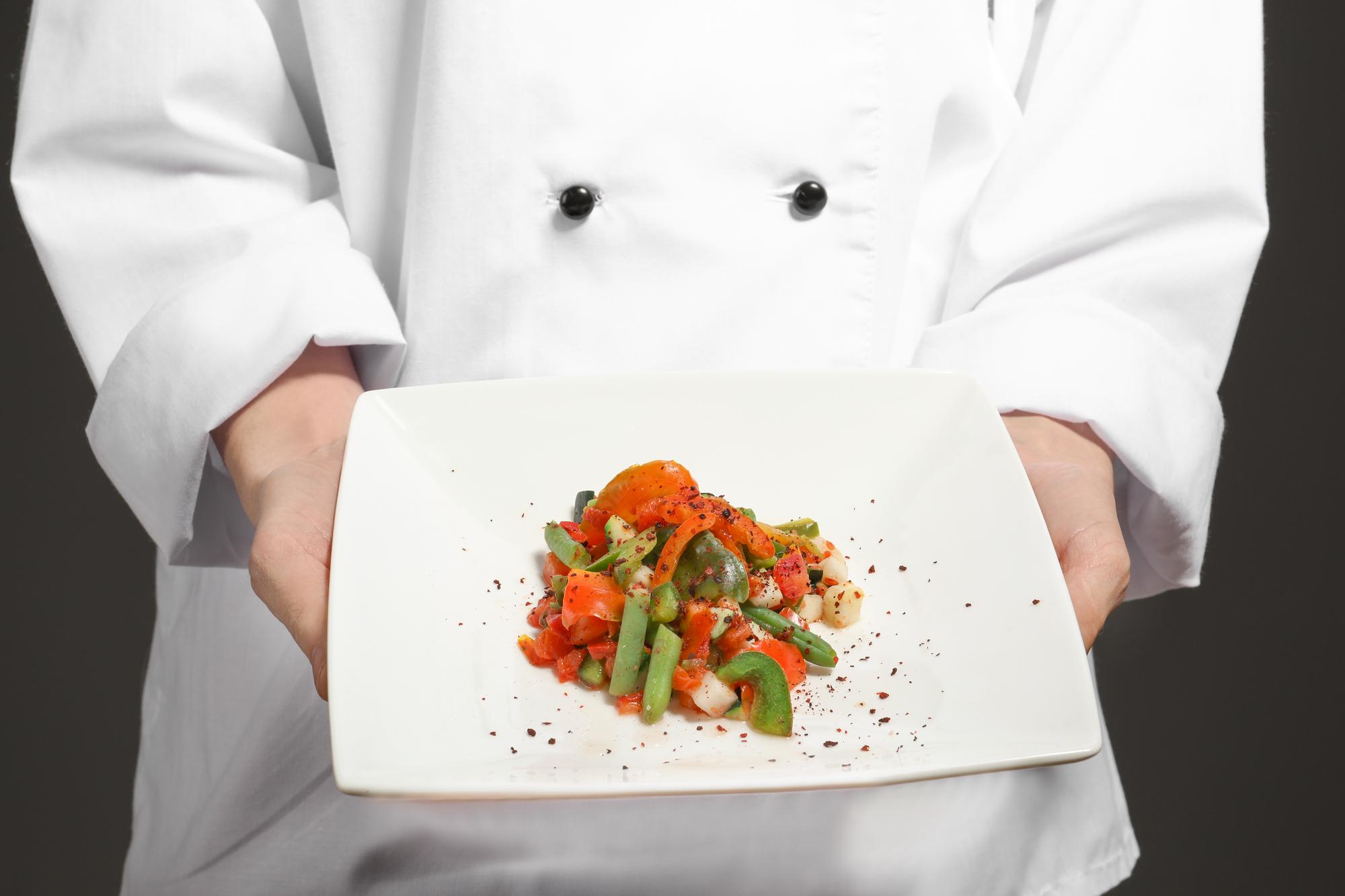 Chef demonstrating plating technique